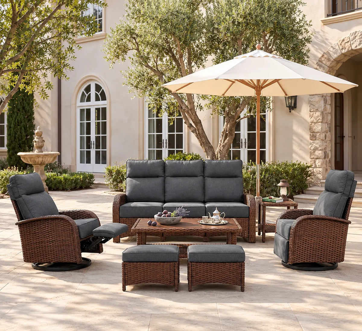 Gray 7-piece patio furniture set with two reclining chairs, three-seat sofa, coffee table, two ottomans, and side table